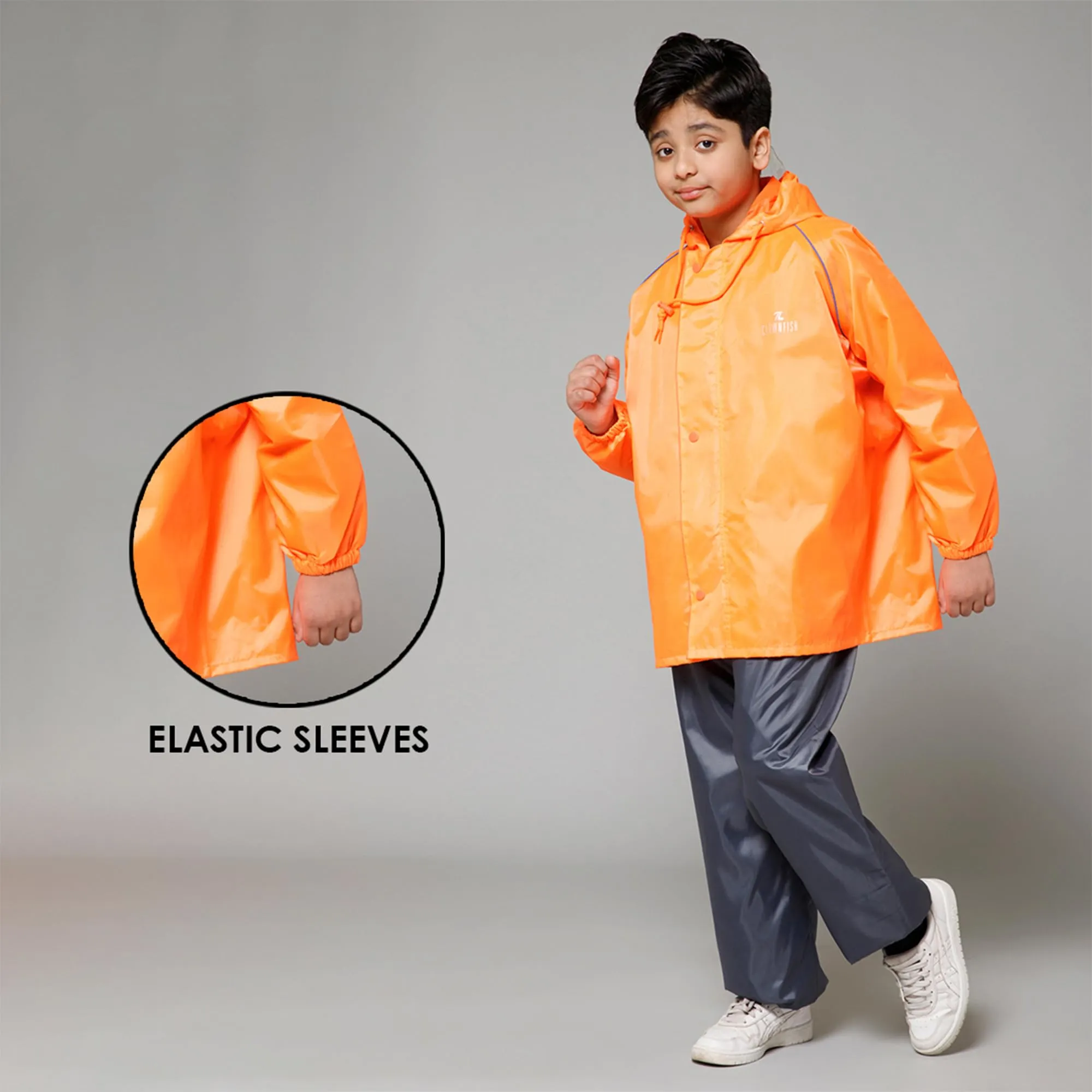 THE CLOWNFISH Duke Series Kids Waterproof Polyester Double Coating Reversible Raincoat with Hood and Reflector Logo at Back. Set of Top and Bottom. Printed Plastic Pouch. Kid Age-14-16 years (Orange)