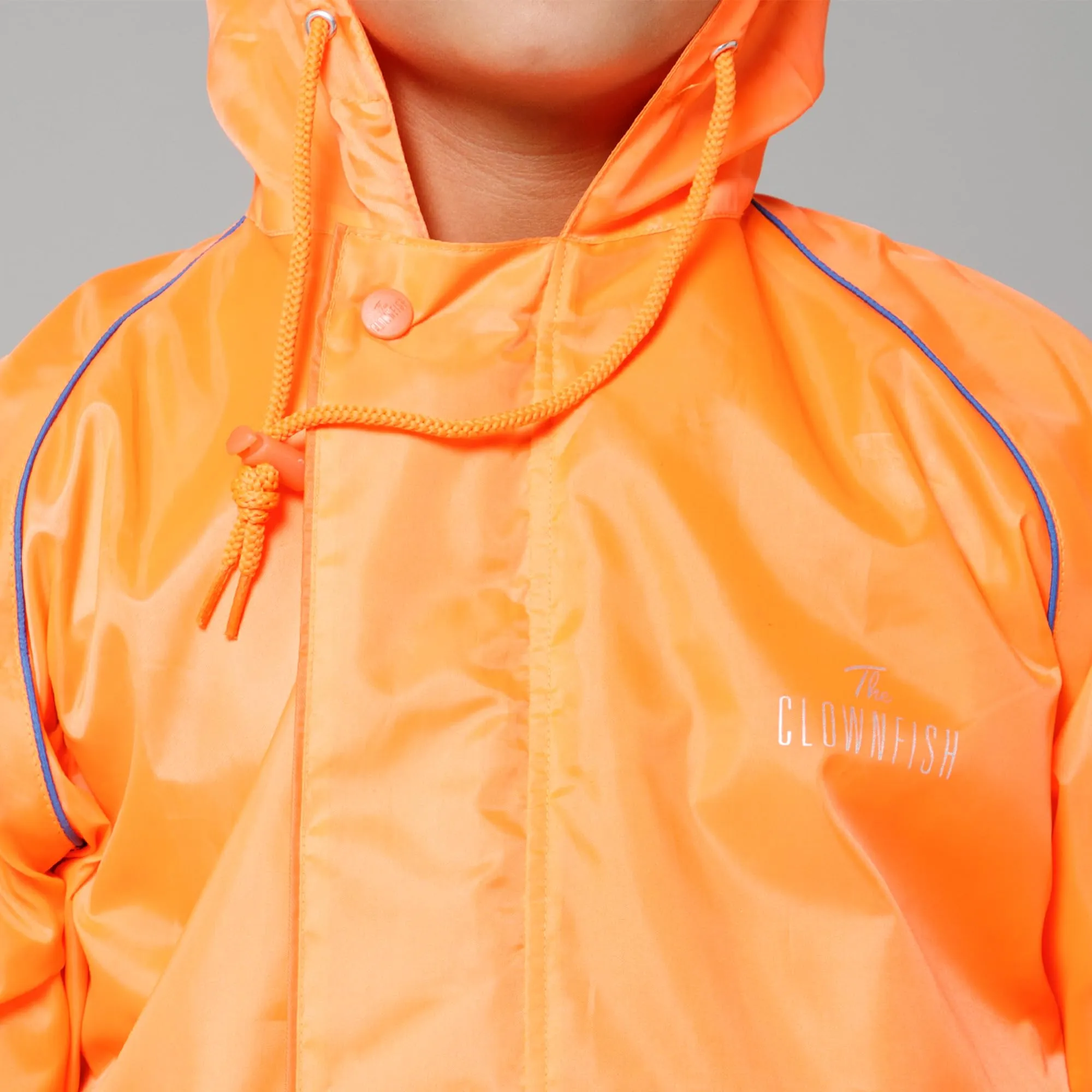 THE CLOWNFISH Duke Series Kids Waterproof Polyester Double Coating Reversible Raincoat with Hood and Reflector Logo at Back. Set of Top and Bottom. Printed Plastic Pouch. Kid Age-14-16 years (Orange)