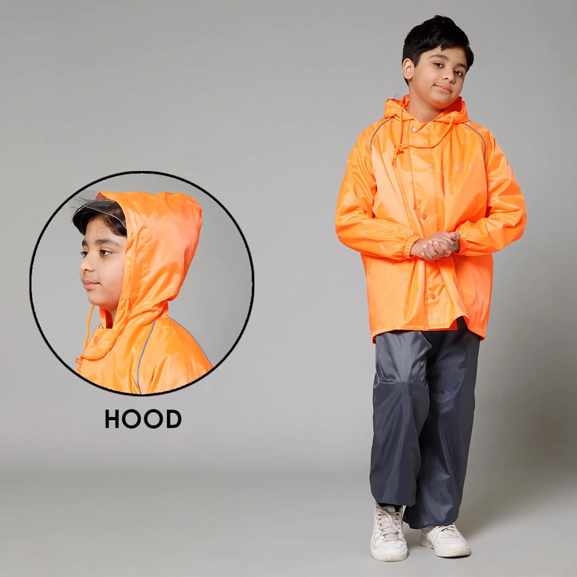 THE CLOWNFISH Duke Series Kids Waterproof Polyester Double Coating Reversible Raincoat with Hood and Reflector Logo at Back. Set of Top and Bottom. Printed Plastic Pouch. Kid Age-14-16 years (Orange)
