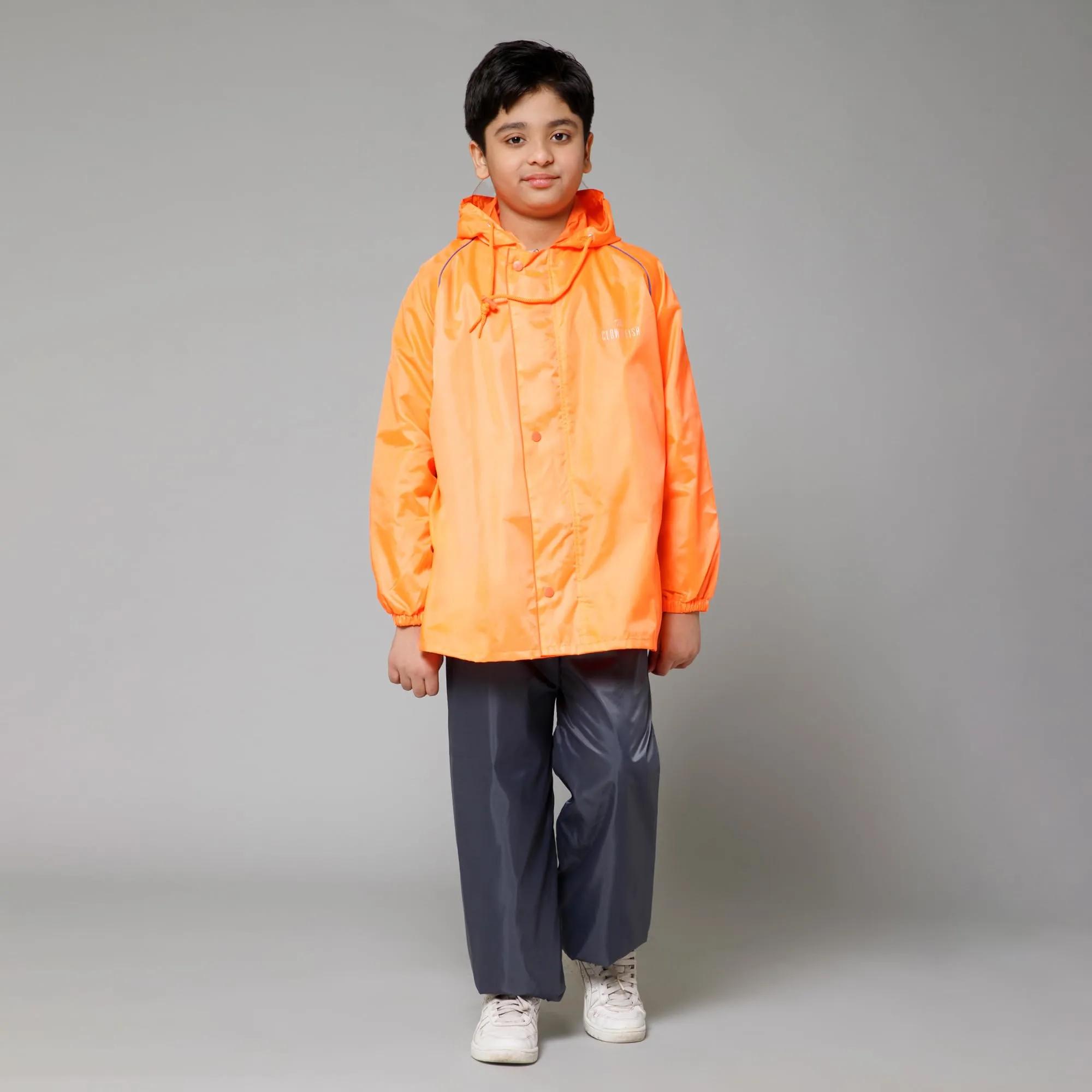 THE CLOWNFISH Duke Series Kids Waterproof Polyester Double Coating Reversible Raincoat with Hood and Reflector Logo at Back. Set of Top and Bottom. Printed Plastic Pouch. Kid Age-14-16 years (Orange)