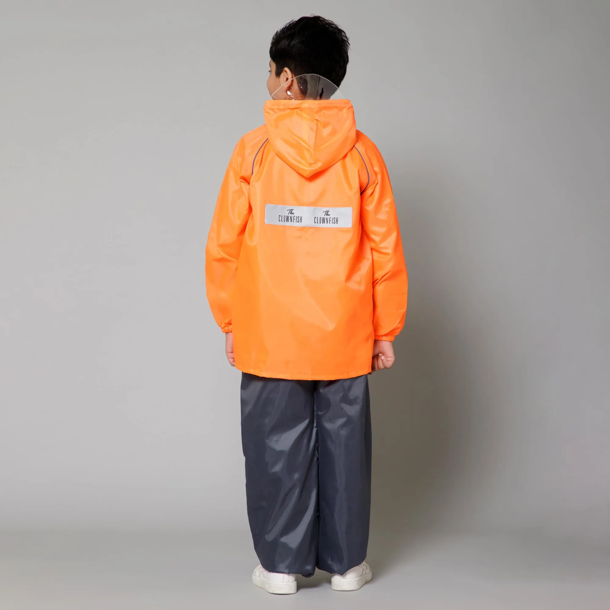 THE CLOWNFISH Duke Series Kids Waterproof Polyester Double Coating Reversible Raincoat with Hood and Reflector Logo at Back. Set of Top and Bottom. Printed Plastic Pouch. Kid Age-14-16 years (Orange)